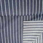 Afbeelding van denim spijkerstof streep in indigo blauw, duurzaam en ideaal voor mode- en decoratie Bestel online in Utrecht Bij makomastoffen