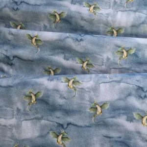 Draken tricot stof drakenprint op mistige lucht ideaal voor kinderkleding Bij makomastoffen online stoffenwinkel Groningen