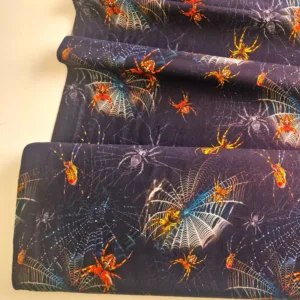 Spinnen stoere rekbare tricotstof. Zwarte tricot met feloranje spinnen stoffenwebwinkel Brabant