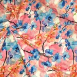 Tricotstof met blauwe orchidee bloemenmotief De stoffenwebwinkel Utrecht