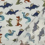 Katoenstof met Draken Voor kleding en kinderkamer aankleding In de stoffenwebwinkel online Makomastoffen